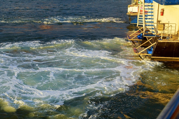 Waves from tourist boats the manhattan new york motor boat in the sea