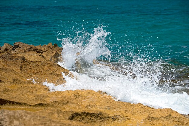 Waves on lava rocks