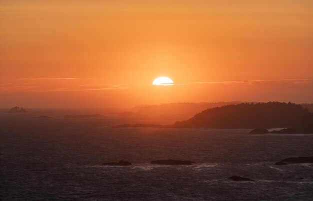 Waves on the pacific ocean on a rocky beach west coast sunny summer sunset