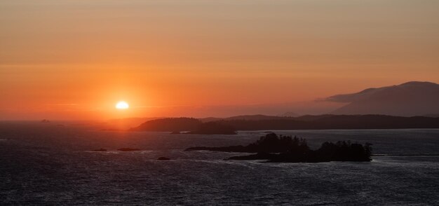 Waves on the pacific ocean on a rocky beach west coast sunny summer sunset