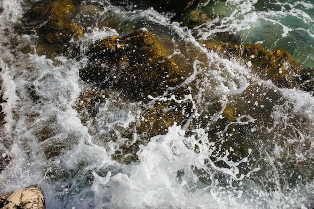 The waves of the sea on the stony beach of Kefalonia