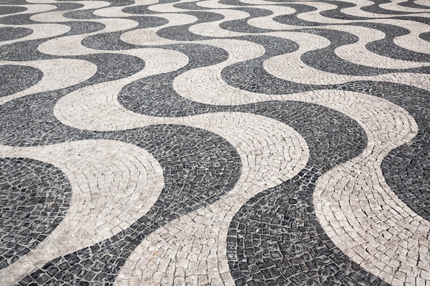 Waves of tiled floor in portuguese traditional style, Rossio square, Lisbon