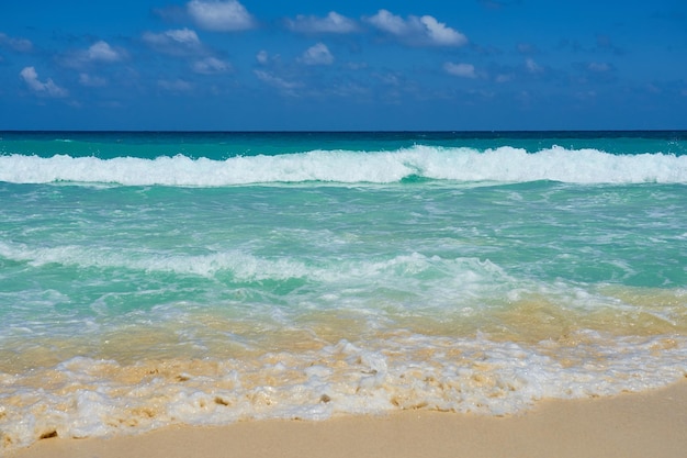 Waves with foam on the Caribbean coast in Mexico