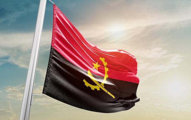 Waving Flag of angola in the Sky. The symbol of the state on wavy cotton fabric.