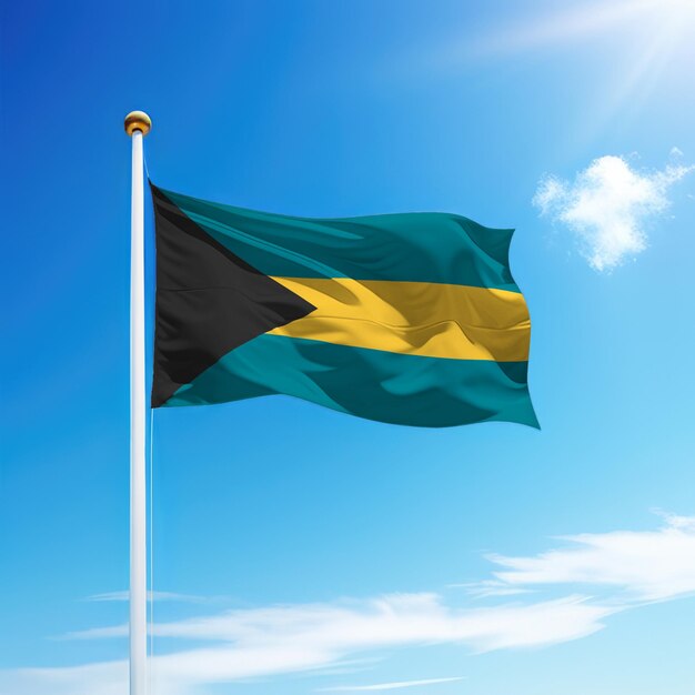 Waving flag of bahamas on flagpole with sky background