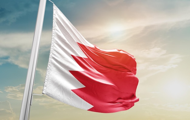 Waving Flag of Bahrain in the Sky. The symbol of the state on wavy cotton fabric.