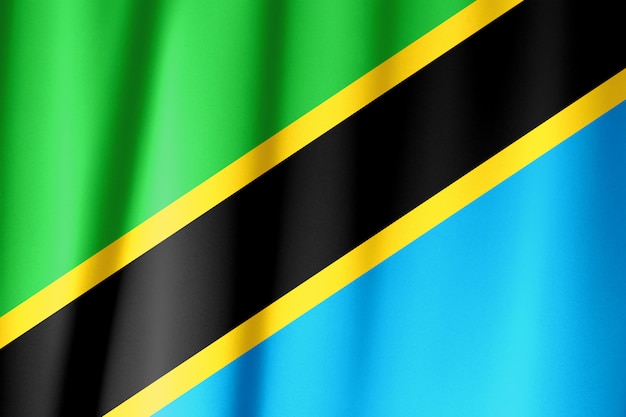 Sventolando la bandiera della tanzania. la bandiera ha una vera trama del tessuto.