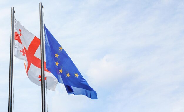 Waving  flags of the European Union and Georgia