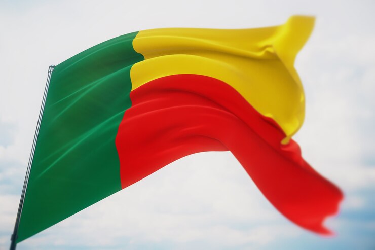 Waving flags of the world - flag of Benin. Shot with a shallow depth of field, selective focus. 3D illustration.