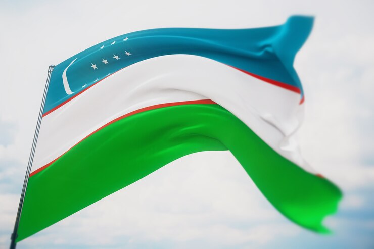 Waving flags of the world - flag of Uzbekistan. Shot with a shallow depth of field, selective focus. 3D illustration.