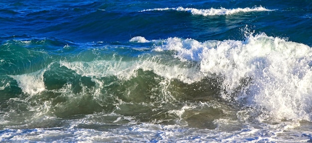 Waving sea on the coastline Splash water