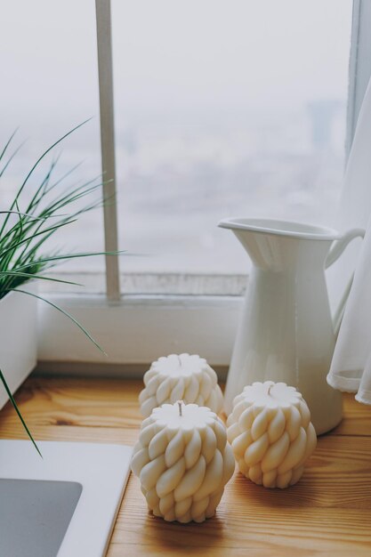 Wax candles amongst flowers in the interior subject photography