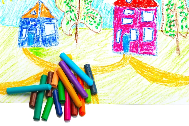 Wax crayons and a children's drawing