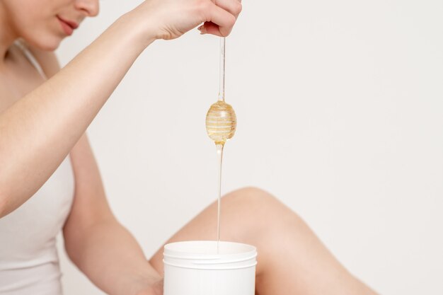 Wax flowing down into container