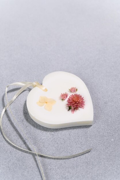 Wax Sachet in Form of Heart with Dried Flowers Closeup Product Photography