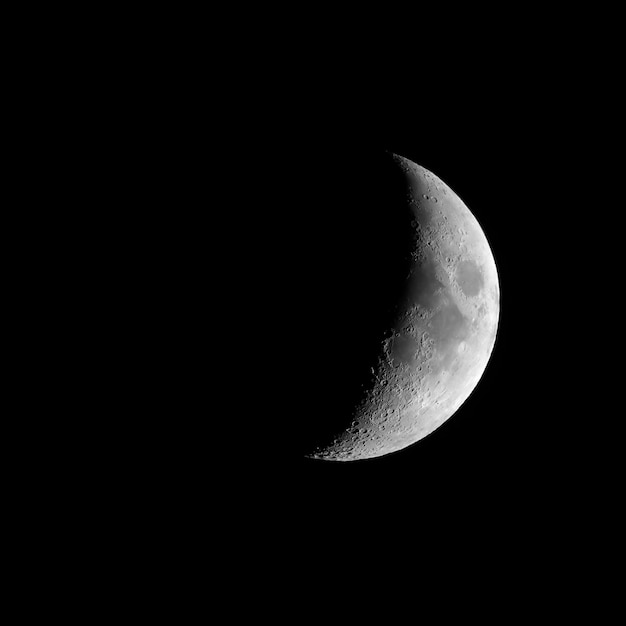 Photo waxing crescent moon seen with telescope