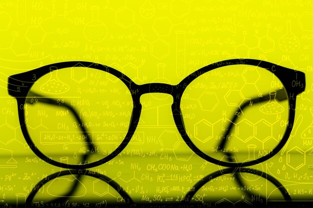 Way to improve vision Contact lenses in container near glasses on yellow background top view copy s