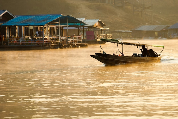 A way of River Life. Villager travel distance by local speed boat in the backwaters, People of the region depend on boats for their transporting needs.