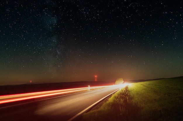 The Way to the Stars light trails at night with starry sky