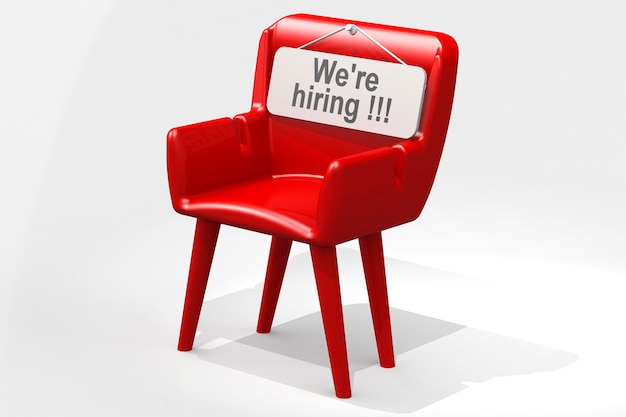 Photo we are hiring banner on red chair isolated