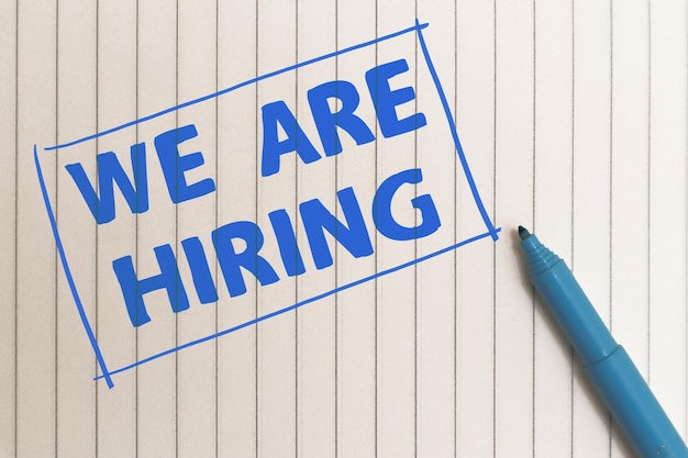 we are hiring text written on white paper life and business motivational inspirational concept