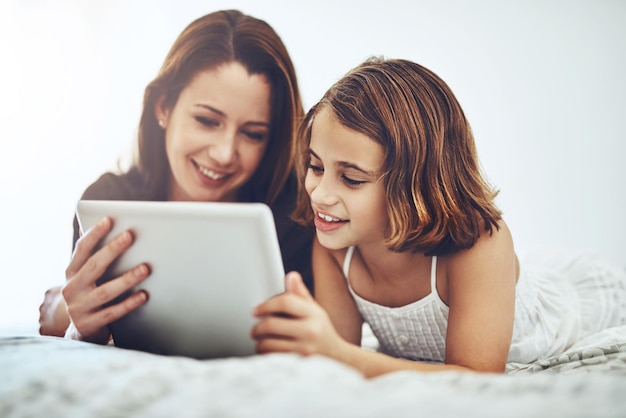 We have entertainment to last us all day long Shot of a little girl and her mother using a digital tablet together