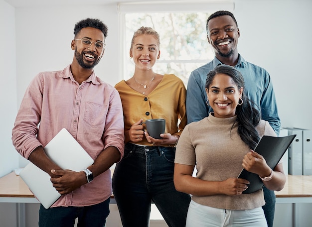 We have some great plans for this business Cropped portrait of a diverse group businesspeople standing together after a successful discussion in the office