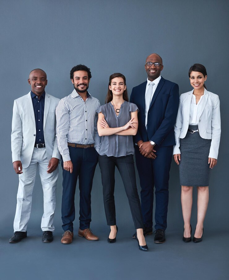 Photo we here for the opportunity studio shot of corporate businesspeople posing against a gray background