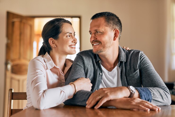 Photo we make a great team cropped shot of a married couple spending the day indoors