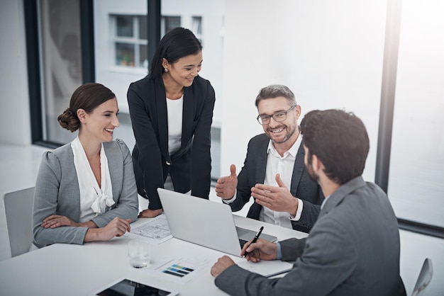 We should move forward with this Shot of a group of businesspeople meeting in the boardroom