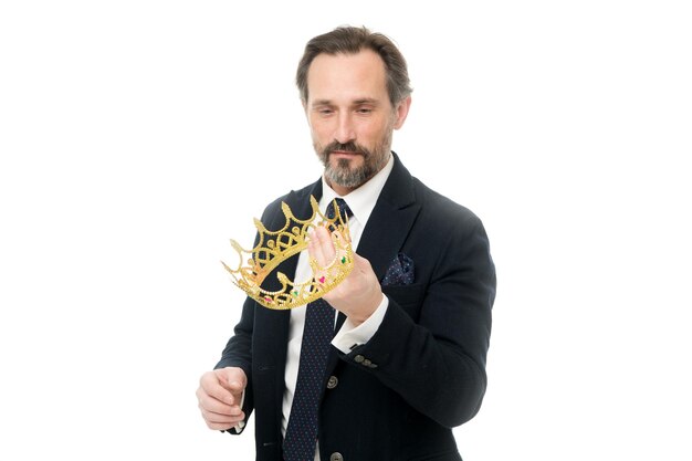 Wealth and authority Fit for a king Mature businessman holding crown Senior man representing power and triumph Success in business King of style Achieving victory and success Business king