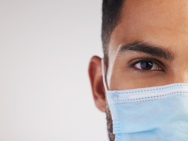 Wear your mask because no one is invincible cropped shot of an unrecognizable nurse standing alone i