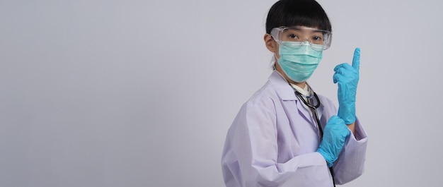 Wearing gloves Asian doctor wear blue rubber nitrile hands glove Doc with a mask putting on gloves