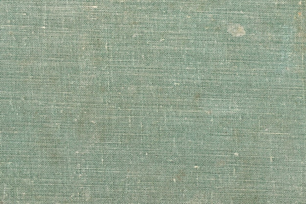 古い本の表紙から風化した生地の背景古い本の表紙