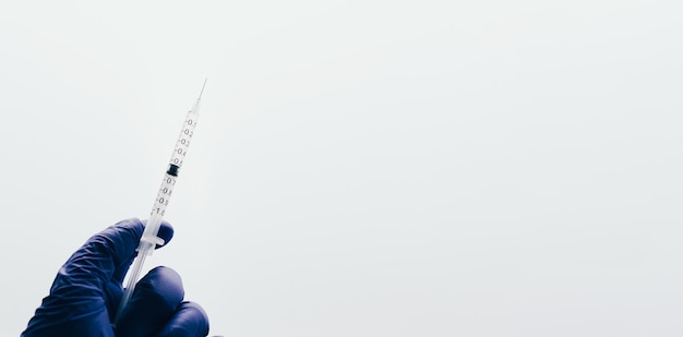 Web banner of syringe vaccine over white background and copy space Medical concept Insurance