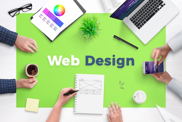 Web design text on office desk Concept of web development team work space Flat design flat page on laptop and smart phone