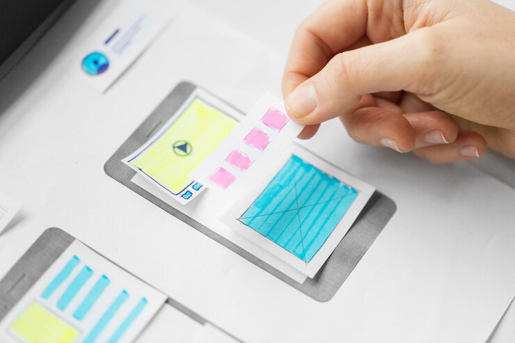 Photo web designer working on user interface wireframe