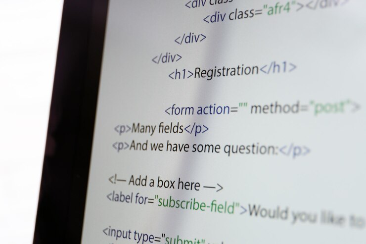 Photo web site codes on computer monitor