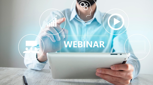 Webinar icon with man holding a tablet