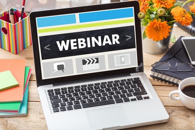 Photo webinar on a laptop screen on an office desk