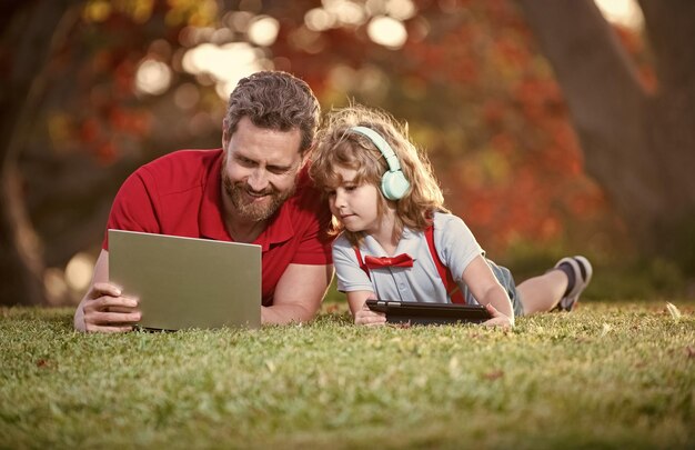 Webinar video lesson online education on laptop father and son use modern communication technology