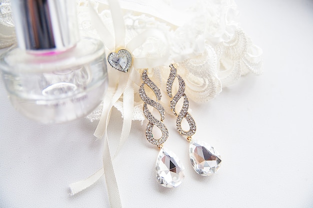 Wedding accessories, perfume and earrings