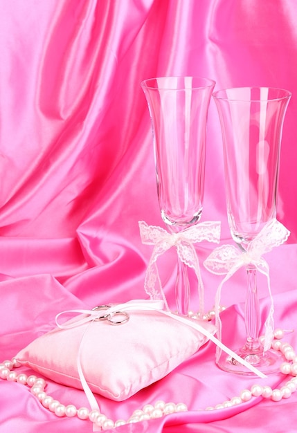 Wedding accessories on pink cloth background