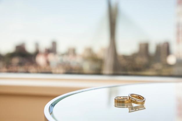 wedding band with a blurred cable-stayed bridge in Sao Paulo, Brazil.