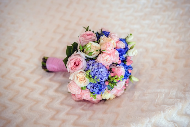 Wedding bouquet on a beige soft surface