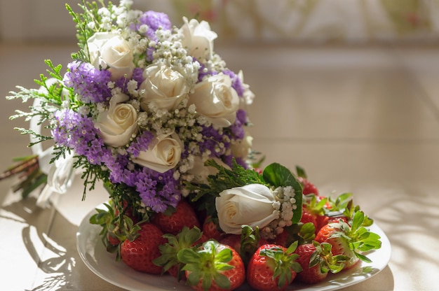 Wedding bouquet and boutonniere of white roses