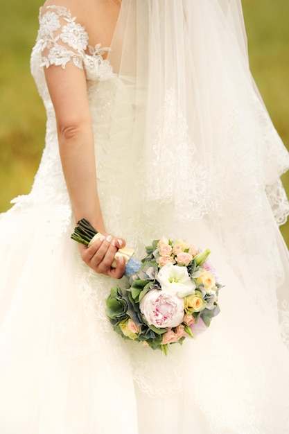 Wedding bouquet in bride hands