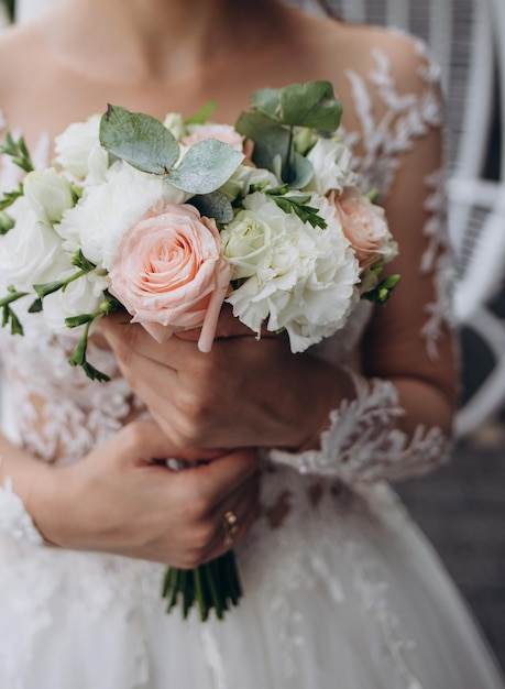 Wedding bouquet in bride's hands beautiful wedding flowers