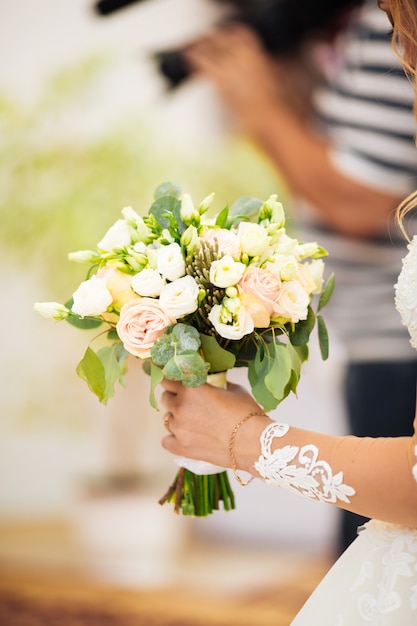 Wedding bouquet in bride's hands, david austin