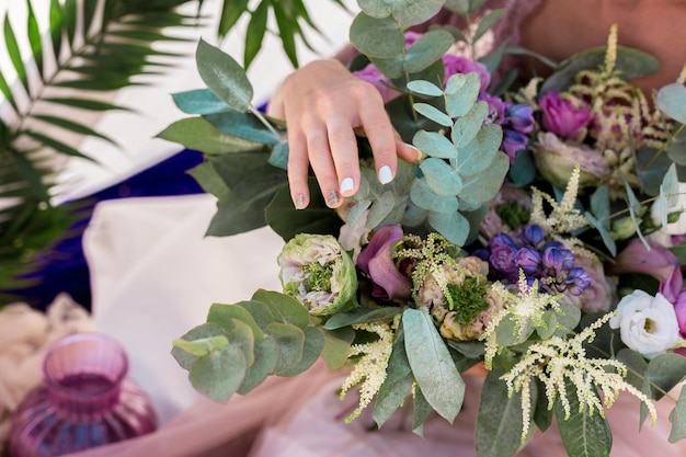 Wedding bouquet at brides hands